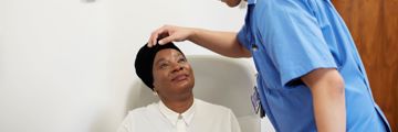 International patient has her eye examined