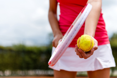 A young woman playing tennis