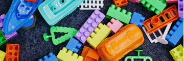 Colourful children's toys on a carpet