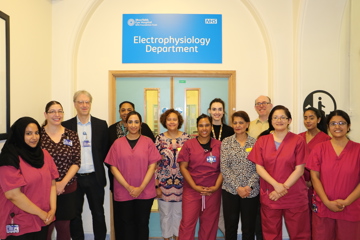Electrophysiology team, men and women, standing in Moorfields hospital.