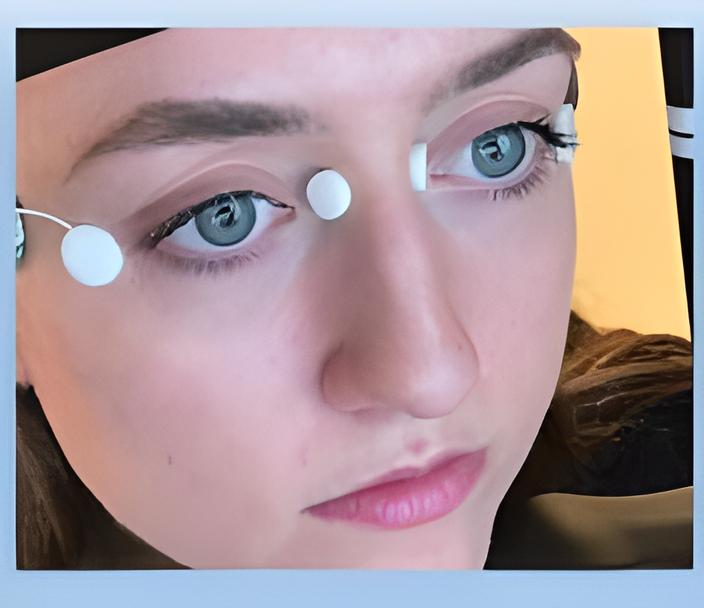 Close-up of a face undergoing electrophysiology tests