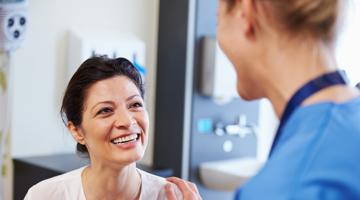 A doctor talking to the patient
