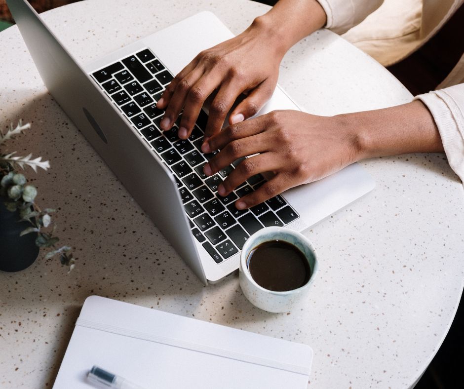 A person typing on the laptop