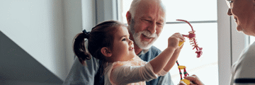 Grandparent and grandchild playing