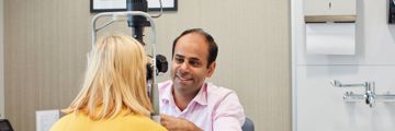 Mr Romil Patel examines a patient